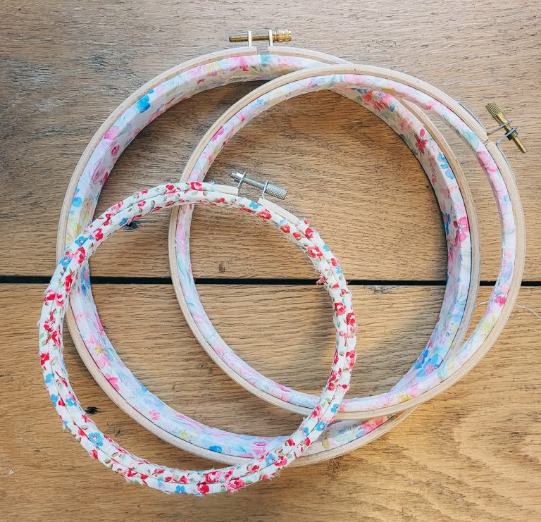 Three fabric-wrapped embroidery hoops